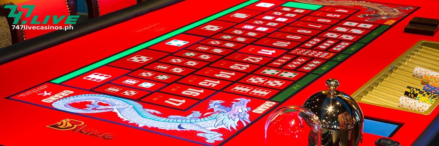 red Sic Bo table with betting options, dice and dragon design with chips.