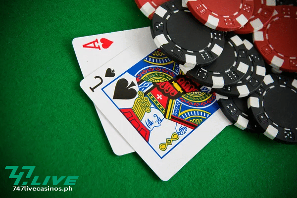 blackjack cards with chips on top of the blackjack table